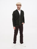 Man in sand linen newsboy cap full body standing casual outfit