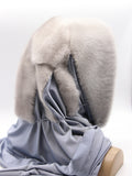 Detail view blue-grey jersey shawl fabric of sapphire mink fur hat hood showing soft knit texture and plain edge