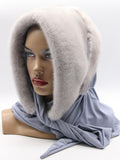 Three-quarter view sapphire mink fur hat hood showing cool blue-grey mink surface and jersey shawl wrap
