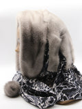 Side profile sapphire mink fur hat hood leopard print scarf on mannequin showing mink pompon and scarf drape