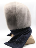 Back view sapphire mink fur hood on mannequin showing full mink coverage and dark dotted fabric scarf tail