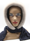 Sapphire mink fur hood front view on mannequin showing clean face opening and dark dotted fabric scarf