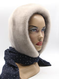 Detail view dark dotted fabric scarf end of sapphire mink fur hood showing plain fabric tip without pompon