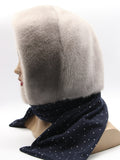 Side profile sapphire mink fur hood scarf showing contrast between pale mink hood and dark fabric scarf