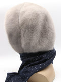Close view sapphire mink hood showing dense flat mink pile and transition edge to dark dotted fabric