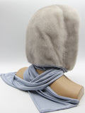 Close three-quarter view sapphire mink hood showing dense flat mink pile texture and clean edge around face