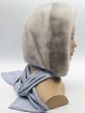 Front view sapphire mink fur hood scarf on mannequin showing coordinated blue-grey mink and fabric tones