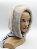 Sapphire mink fur hood scarf on mannequin showing fabric scarf ends tied loosely at front