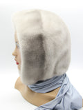 Side profile sapphire mink fur hood scarf showing hood depth and plain fabric scarf end without pompon