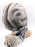 Side view sapphire mink fur hood scarf wrap on mannequin showing scarf length with silver fox pompon
