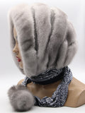 Sapphire mink and suede striped fur hat hood scarf with pompons on mannequin, front view showing alternating mink-suede horizontal stripe construction