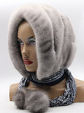 Three-quarter view sapphire mink suede striped fur hat hood showing horizontal stripe texture and scarf ties