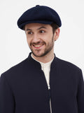 Side close-up navy newsboy cap showing wool texture and slouchy fit detail