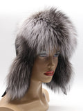 Front view of silver fox fur hat framing the face, full fox brim and long flaps