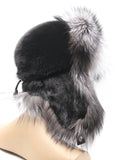 Back three-quarter view of silver fox hat with black mink crown and fox brim on top
