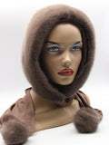 Tobacco brown mink fur hood front view on mannequin showing warm caramel-brown mink surface and clean face opening