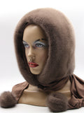 Side profile tobacco brown mink fur hood scarf on mannequin showing hood depth and fabric scarf with mink pompon