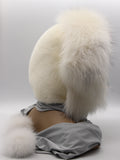 Close view white arctic fox guard hairs framing face opening of mink fur hood wrap