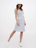 Full-length view of white bucket hat with striped summer dress