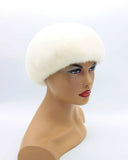 White high-crown mink beret right profile showing sculptural crown height and dense white mink texture