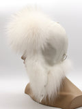 Side view of white leather crown with white fox brim and flaps tied back