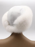 White leather top and arctic fox band, back left three-quarter view of round hat