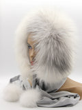 White arctic fox fur hood front view on mannequin showing mink crown and full fox face trim volume