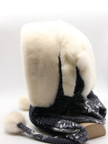 Back view white mink fur hat hood on mannequin showing full white mink coverage and dark floral scarf