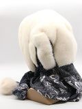 Detail view dark floral fabric scarf of white mink hood showing rose pattern in grey and black tones