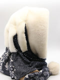 Three-quarter back view white mink fur hat hood with dark floral scarf showing white mink crown and pompon