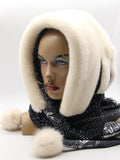 Three-quarter view white mink fur hat hood showing clean white mink surface and dark floral scarf drape