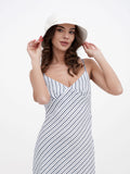 Woman in white sun hat touching brim, close-up of flat crown