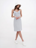 Side view of white cotton sun hat with striped summer dress