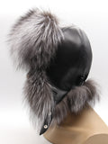 Rear view of women’s aviator hat showing panel-stitched leather and tied ear flaps