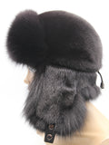 Left profile of women’s black ushanka with ear flaps pulled back behind the head