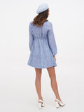 Women's blue French beret hat full body view with long-sleeve blue linen dress and white shoes