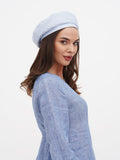 Women's blue linen beret hat side profile close-up showing powder blue color and flat crown structure