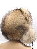 Women’s fur trapper hat in raccoon, left three-quarter view with flaps framing the face