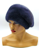 Women's graphite blue mink fur beret with gathered tucks side profile view showing dark blue fur and ridged tuck texture