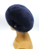 Women's graphite blue mink fur beret three-quarter right view showing gathered crown texture and dark blue fur