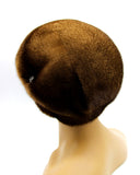 Women's pastel brown mink beret back view showing full dome crown and adjustable band construction