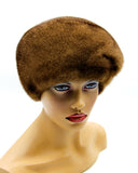 Women's pastel brown mink fur beret classic dome front view showing smooth warm brown fur and clean rounded crown silhouette
