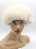 Women's pearl beige mink fur beret front view showing ivory-cream fur color and dome crown silhouette