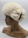 Women's pearl beige mink beret lower back angle showing crown construction and natural ivory-cream mink