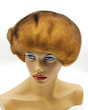 Women's rare golden brown mink fur beret front view showing warm honey-brown color and full flower detail