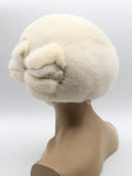 Women's rare pearl beige mink beret three-quarter right view showing warm cream fur and bow detail