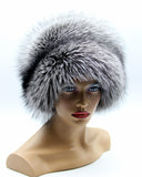 Women’s round fox hat in silver fox with dark swirl across the crown, left angle