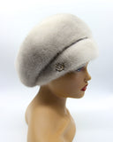 Women's sapphire mink fur beret left profile showing cool blue-grey undertone and voluminous rounded crown