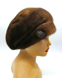 Women's voluminous mink fur beret back view showing full dome crown construction and pastel brown fur coverage