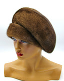 Women's voluminous mink fur beret pastel brown right profile showing dome crown shape and natural fur sheen
